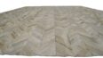 Detail of white chevron patchwork cowhide rug, no border.