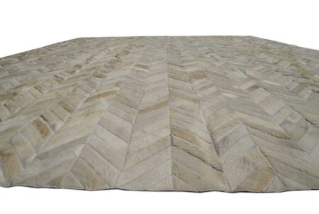 Detail of white chevron patchwork cowhide rug, no border. Detail of white chevron patchwork cowhide rug, no border.