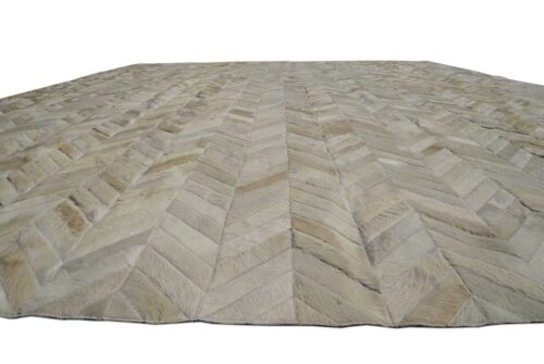 Detail of white chevron patchwork cowhide rug, no border.