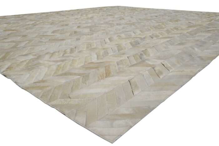 Detail of white chevron patchwork cowhide rug, no border.