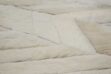 Detail of white herringbone patchwork cowhide rug