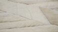 Detail of white herringbone patchwork cowhide rug