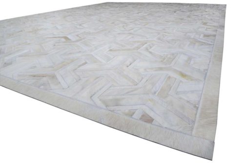 White patchwork cowhide rug 7 inches border, no floor