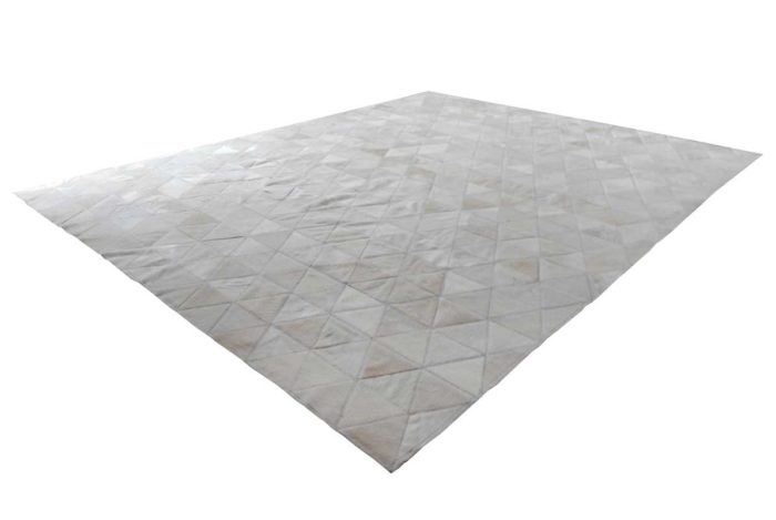 White cowhide patchwork rug in triangles