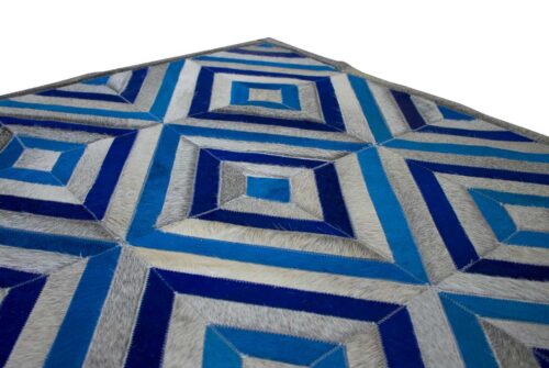 Angle view of a corner of a Grey and Blue Diamond Patchwork Cowhide Rug