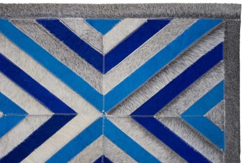 Close up of our Blue and Gray Diamond Patchwork Cowhide Rug with border