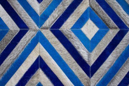 Close up of our Blue and Gray Diamond Patchwork Cowhide Rug Close up of our Blue and Gray Diamond Patchwork Cowhide Rug