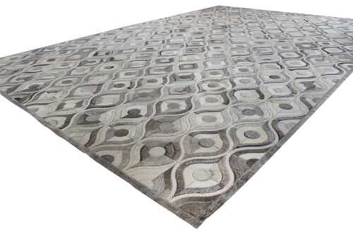 General view of a Gray Patchwork Cowhide Rug in a River Design