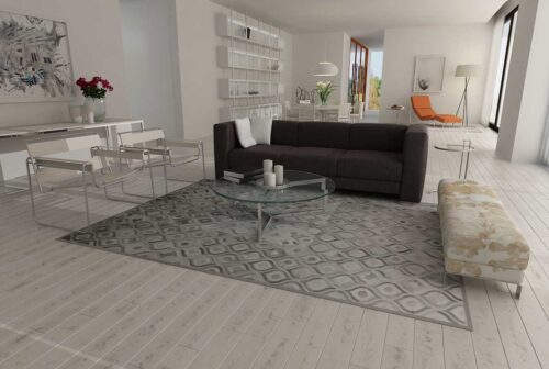 Gray Patchwork Cowhide Rug in our River Design in a White modern living room