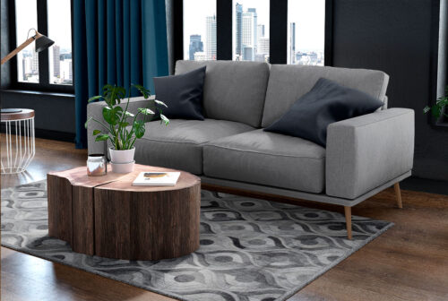 Gray River Patchwork Cowhide Rug in a cozy living room