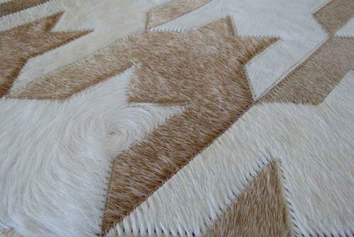 Detail of a White and Beige Leather Area Rug Houndstooth Design