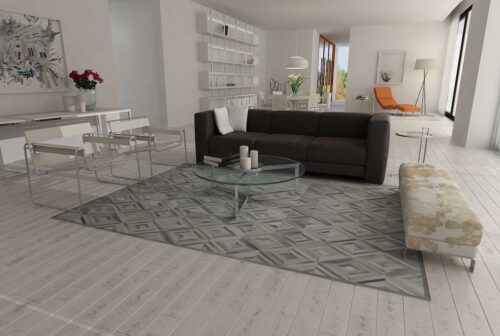Open plan living room, dark sofa and a Taupe and Cream Diamond Patchwork Cowhide Rug