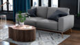 Living room with a Diamond cowhide Patchwork Rug in gray and taupe