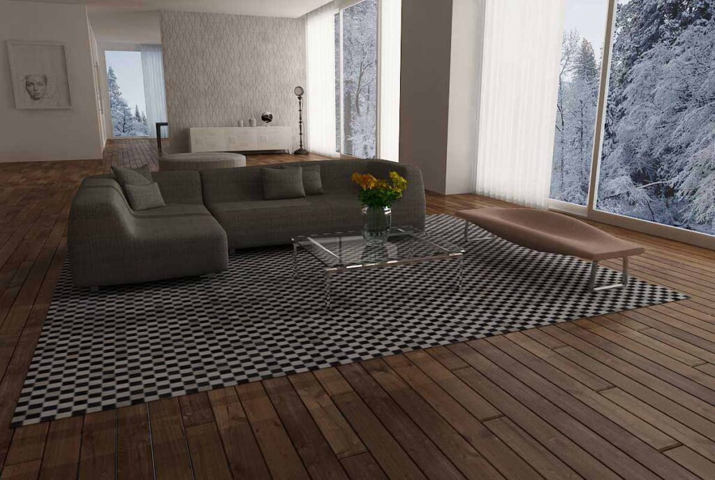 Checkerboard patchwork cowhide rug with dark wooden plank floor