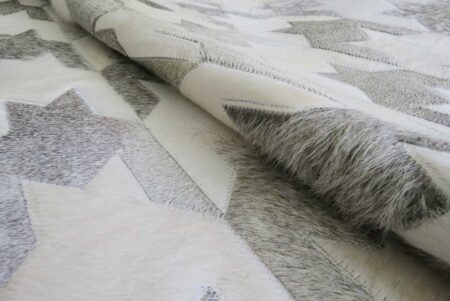 Grey and white cowhide patchwork Rug in herringbone Design Grey and white cowhide patchwork Rug in herringbone Design