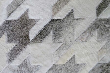 Detail of White and gray cowhide Area Rug Houndstooth Design Detail of White and gray cowhide Area Rug Houndstooth Design
