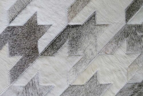 Detail of a White and Beige Leather Area Rug Houndstooth Design