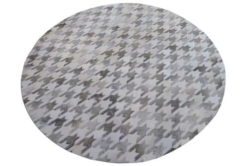 Round White and taupe patch cow rug in Houndstooth pattern