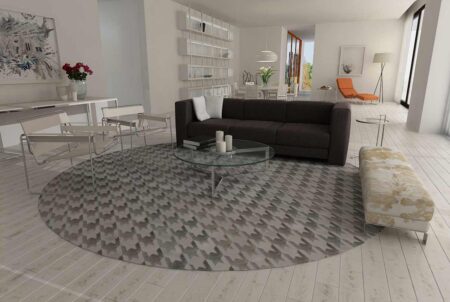 round cow hide rug in herringbone pattern on light wooden floor round cow hide rug in herringbone pattern on light wooden floor