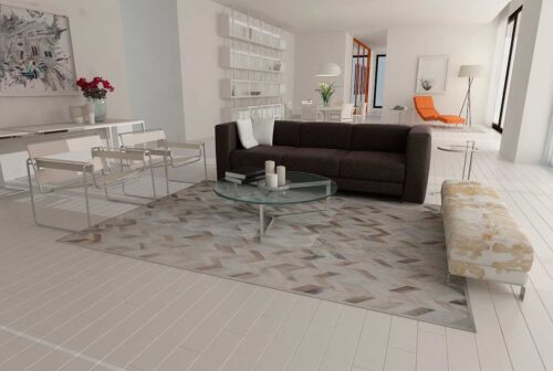 Taupe and cream Chevron Patchwork Cowhide Rug in an open living room