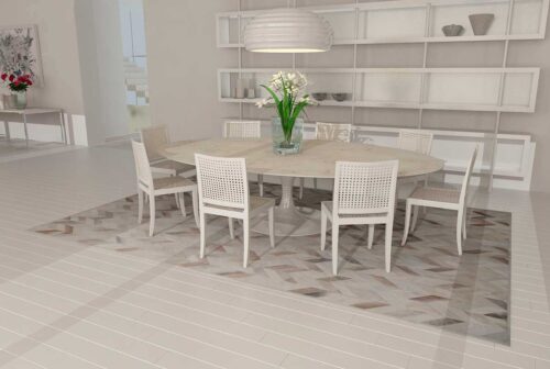 Taupe and cream Chevron Patchwork Cowhide Rug used in a dining room