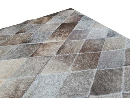 Edge of a LIME Taupe Ombre Cowhide Rug Edge of a LIME Taupe Ombre Cowhide Rug in small Rhombus Patches