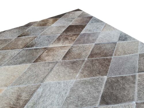 Edge of a LIME Taupe Ombre Cowhide Rug in small Rhombus Patches