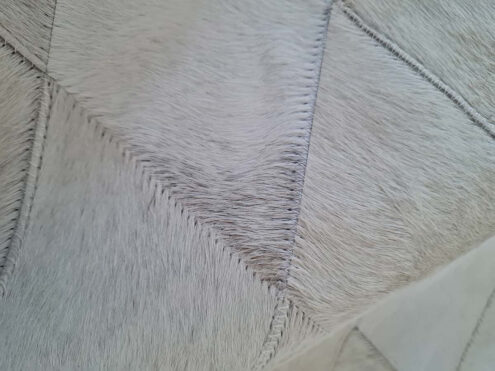 Close up detail of trapezoids from our LIME Ombre Taupe Patch work Cowhide Rug Close up detail of trapezoids from our LIME Ombre Taupe Patch work Cowhide Rug