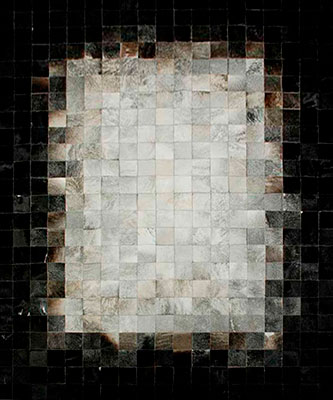 White, gray and black patchwork cowhide rug in squares