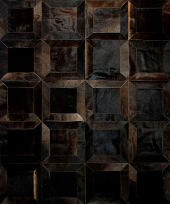Chocolate brown patchwork cowhide rug in the cube design with big squares