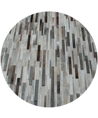 Round taupe gray cowhide patchwork rug in Stripes