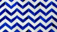 Blue and white cowhide patchwork rug in a chevron design