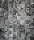 Dark gray patchwork cowhide rug in a moorish star design