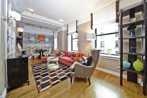 New York apartment featuring a 3D pattern patchwork cowhide rug in black, white and firey orange
