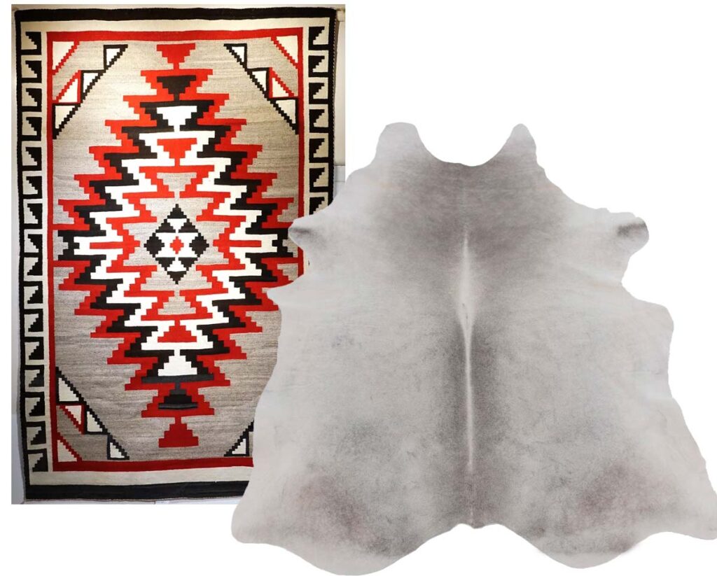 Red, Black, White and Cream Navajo style Rug paired with a light Gray COwhide Rug