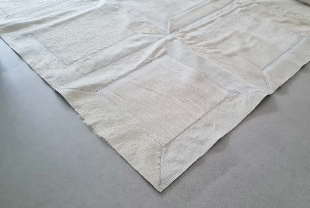 Detail of a White Cube Cowhide Patchwork Rug