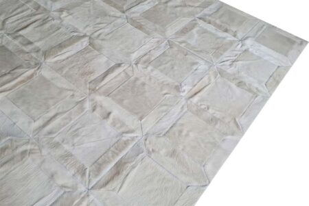 Side view of a Cube Patch Cowhide Rug in White Side view of a Cube Patch Cowhide Rug in White