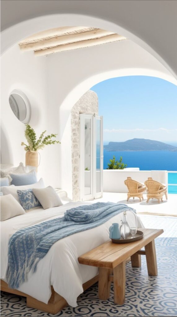 interior design. bedroom n white and light blue with arched window overlooking the ocean