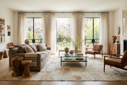 Large Beige Mona patchwork cowhide rug in spacious living room interior