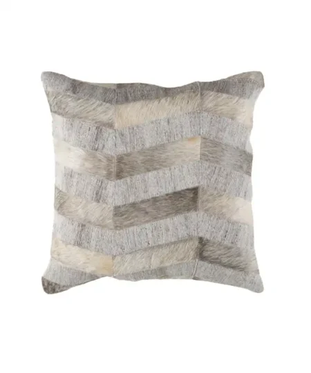 Close-up of a square decorative throw pillow featuring a textured chevron patchwork design made of alternating strips of gray, cream, and beige natural cowhide and woven fabric.