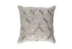 A single, isolated photograph of a square decorative cushion against a plain white background, featuring the intricate geometric hide and fabric pattern in cream, beige, and grey.