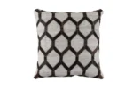 A single, isolated, square throw cushion featuring a precise repeating geometric pattern. The pattern is composed of alternating panels: light gray textured fabric and pieces of dark brown cowhide with a visible hair texture, forming a stylized hexagonal or lattice design. Detailed stitching runs along the border, and the item is presented on a plain white background.