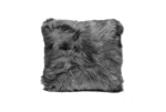 A dark grey, long-haired fluffy throw pillow on white background