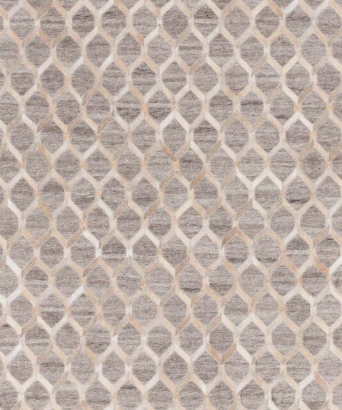 Top view of a trellis pattern cowhide and fabric area rug in beige cowhide and gray taupe fabric, showing the full repeating geometric design
